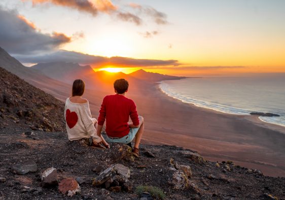 Couple enjoying beautiful sunset on Fuerteventura