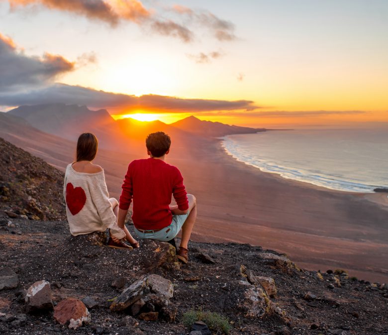 Couple enjoying beautiful sunset on Fuerteventura